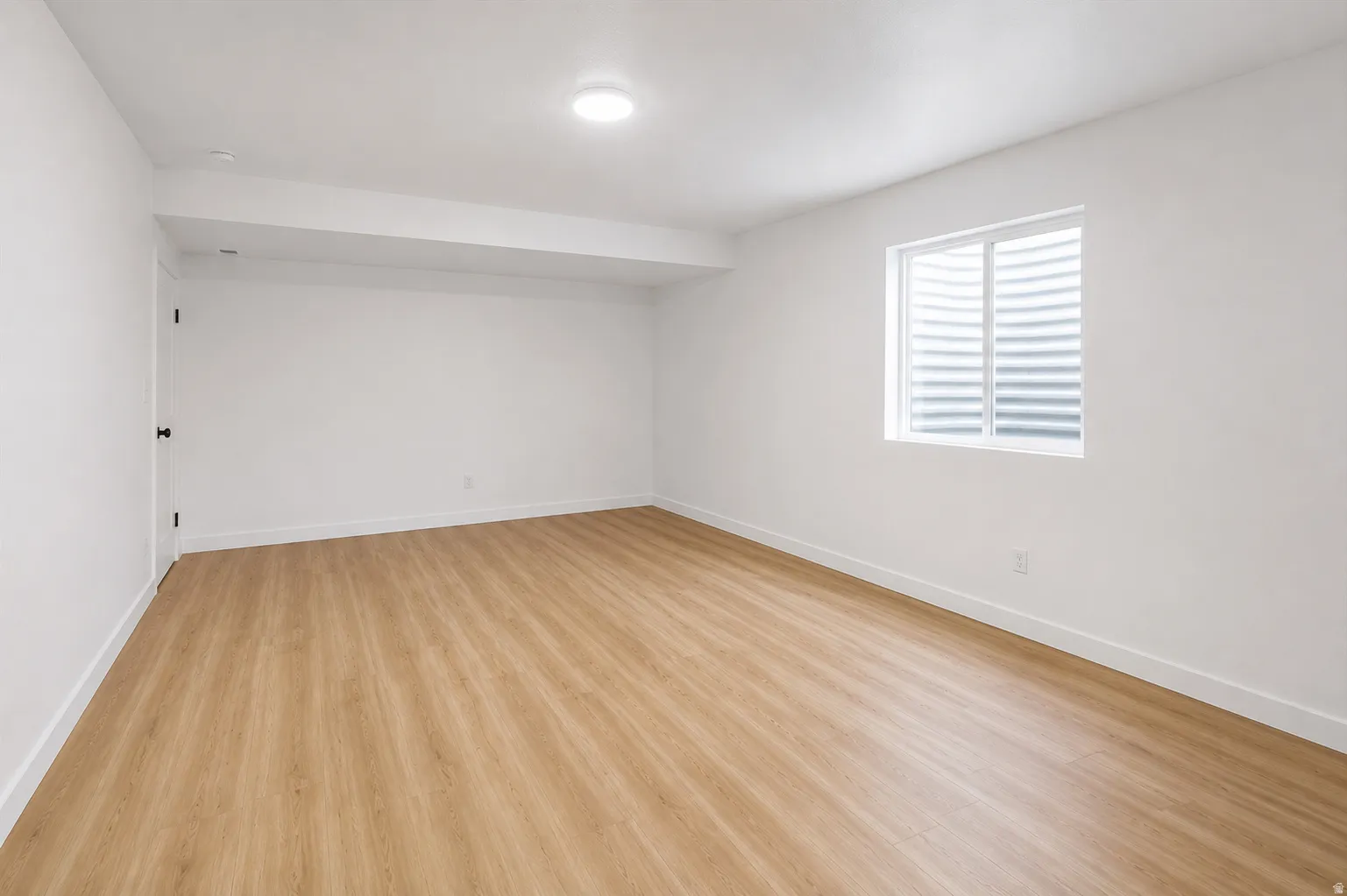 3rd bedroom: This spacious bedroom is located in the builder-finished basement with 9-foot ceilings, which includes a walk-in closet.