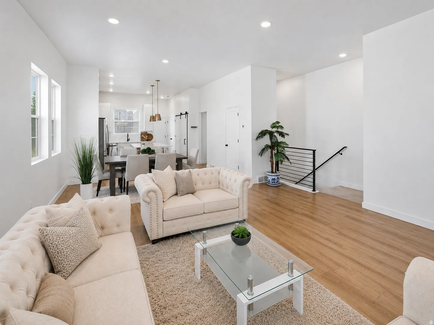 Single-story residence with an open-concept living featuring 10ft ceilings, quartz countertops throughout, and lots of windows for so much natural light! Sink-free island