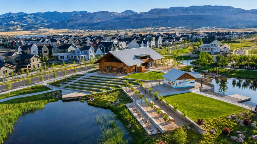 The Cove in Daybreak offers a beautiful place to enjoy the water, with a nearby playground adding even more everyday fun for families and visitors.