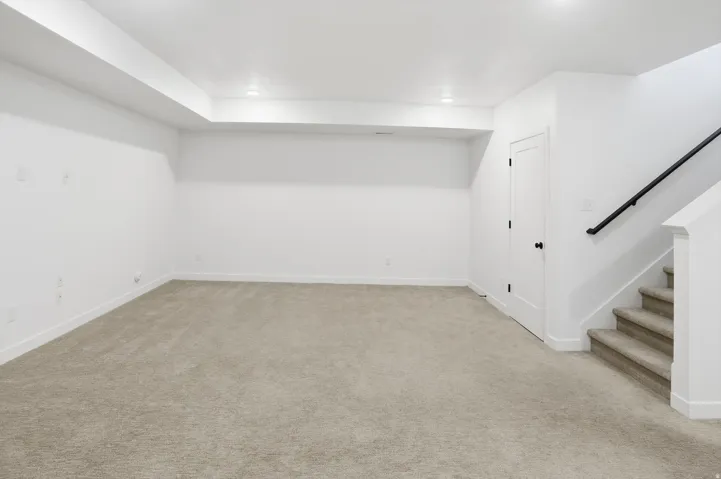 The builder-finished basement expands the home's versatility with 9-foot ceilings, two additional bedrooms, and two open flex spaces that can be used as a secondary living room, media area, private office, fitness space, hobby room, guest area, or potenti