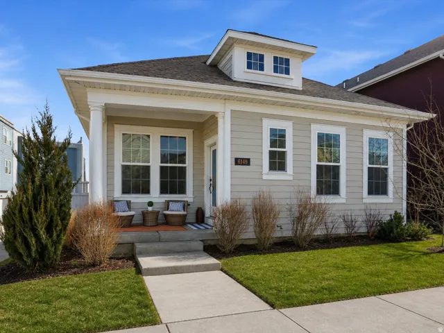 Single-story residence with a covered and welcoming front porch.