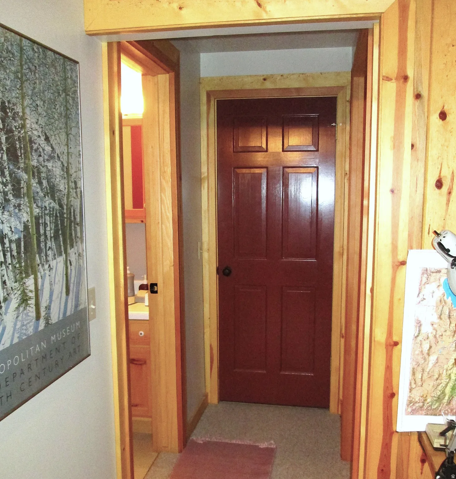 The lower level hallway to the bath, bunk room and utility room.