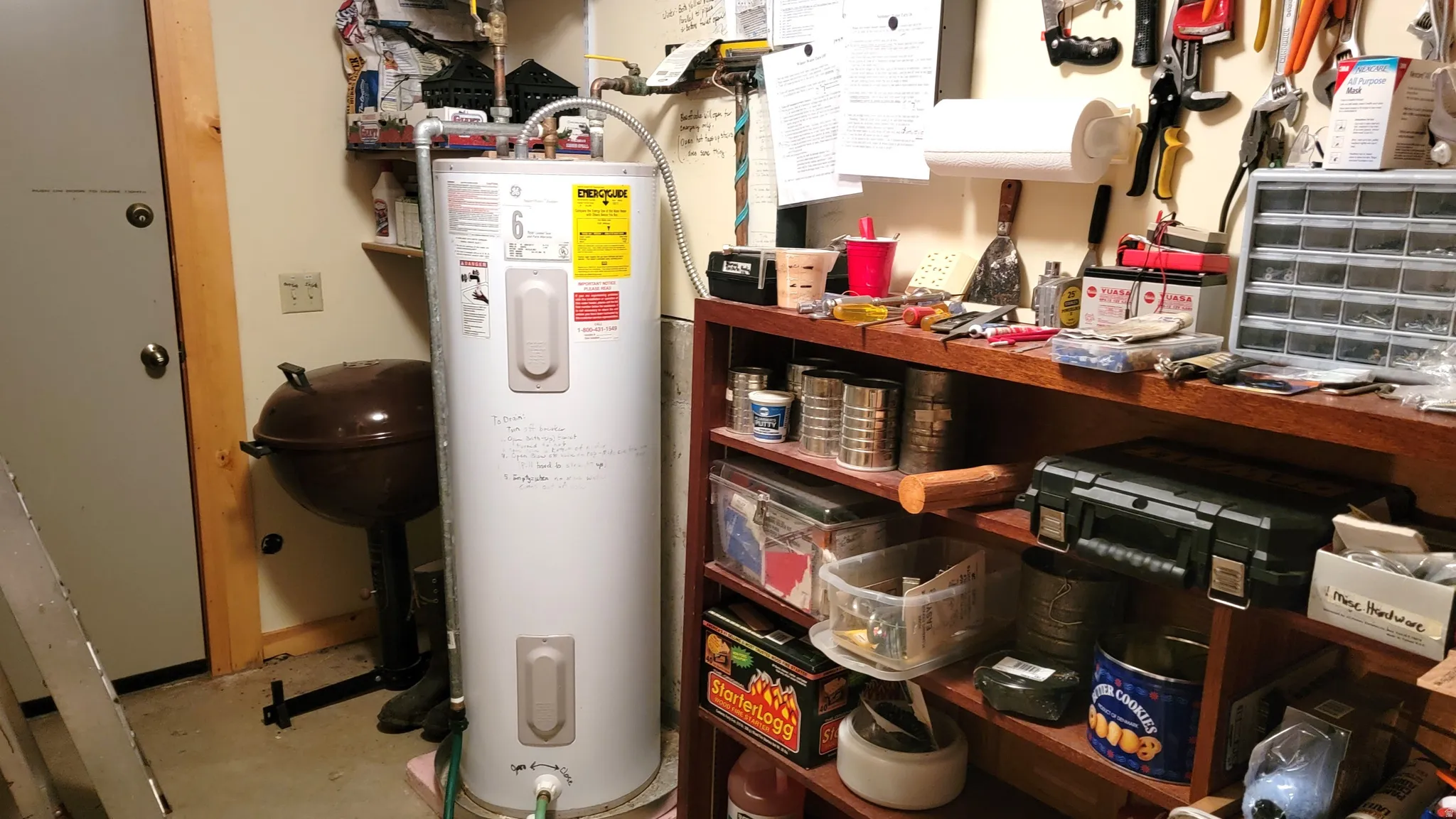 50 Gallon water heater in the utility room and a second door to the back of the cabin. The basement concrete slab floor is a big upgrade from a crawlspace.