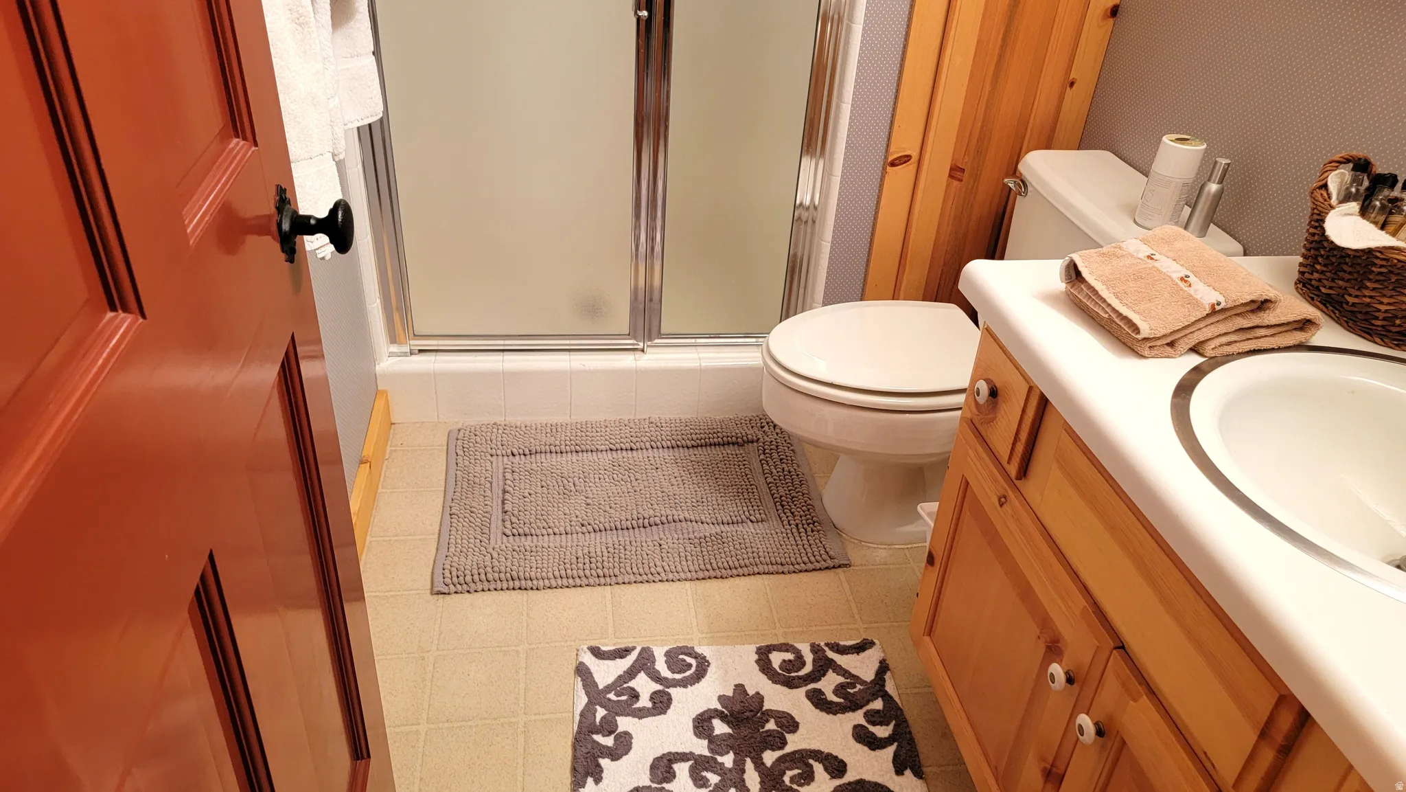 The downstairs bath has a floor to ceiling storage closet.