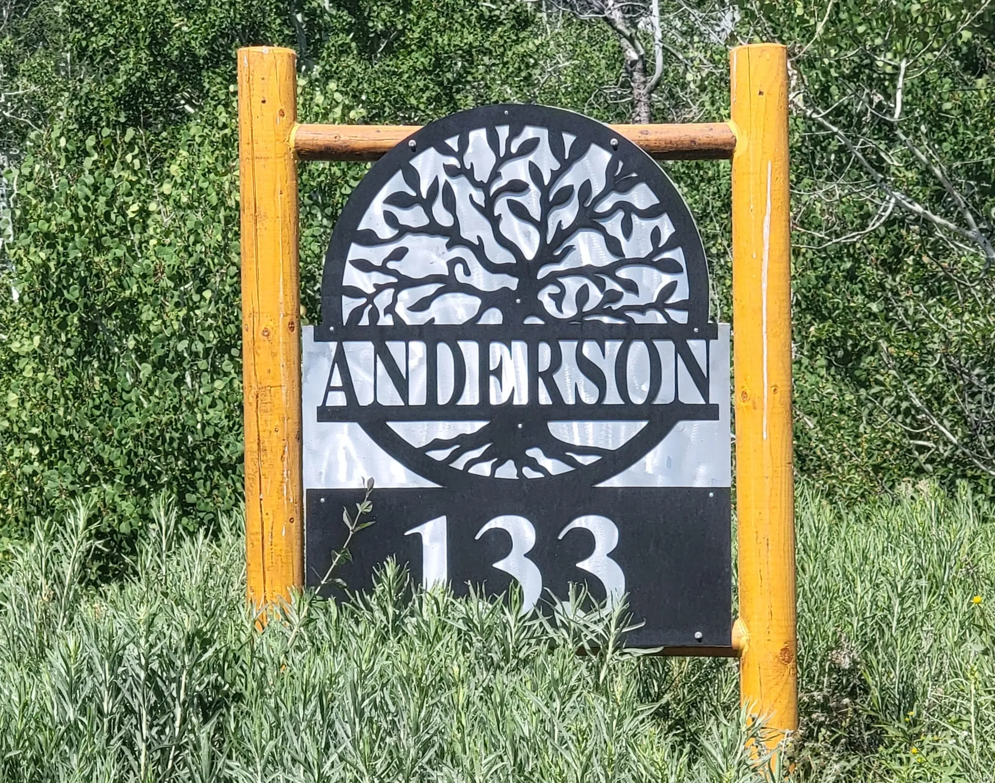 Lot marker sign at the top of the driveway.