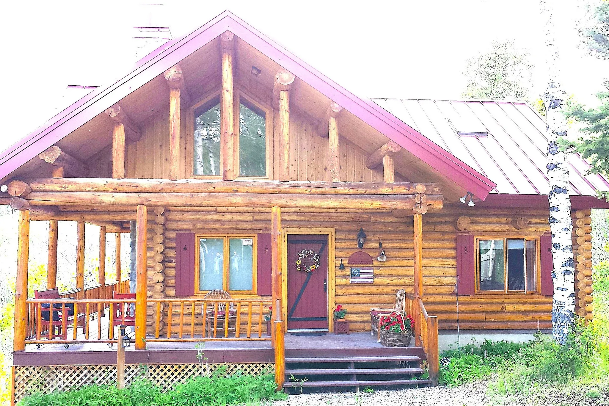 Architectural log beams and supports are throughout the cabin. Clerestory windows in the vaults on the east and south side of the cabin illuminate the interior.