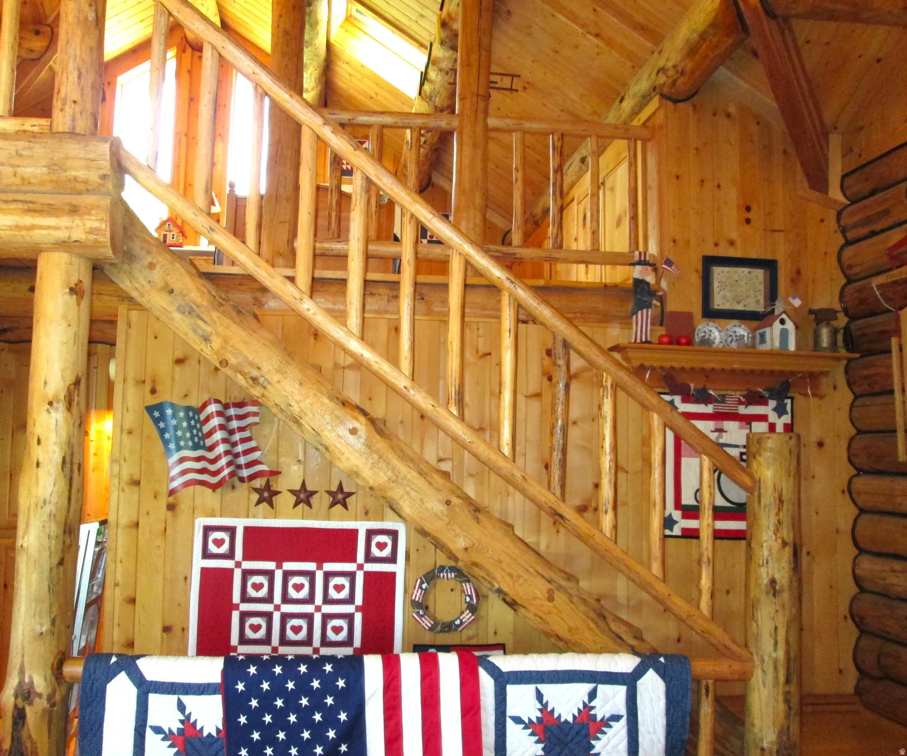 View of the log staircase to the loft, with log railings.