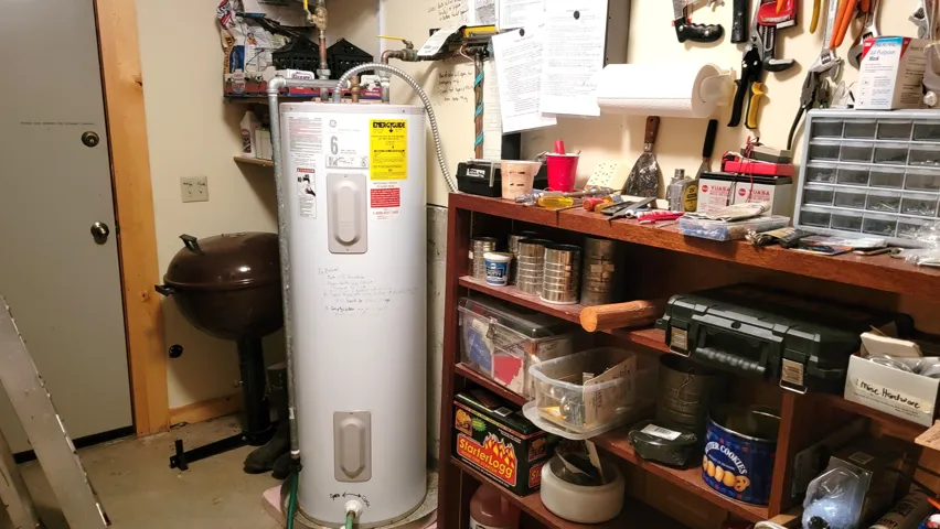50 Gallon water heater in the utility room and a second door to the back of the cabin. The basement concrete slab floor is a big upgrade from a crawlspace.