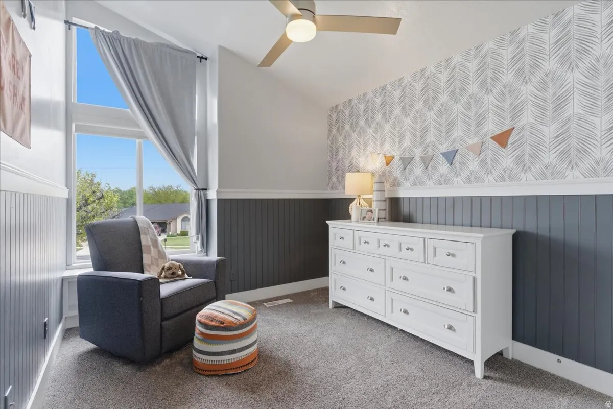 Bedroom with vaulted ceiling with ceiling fan