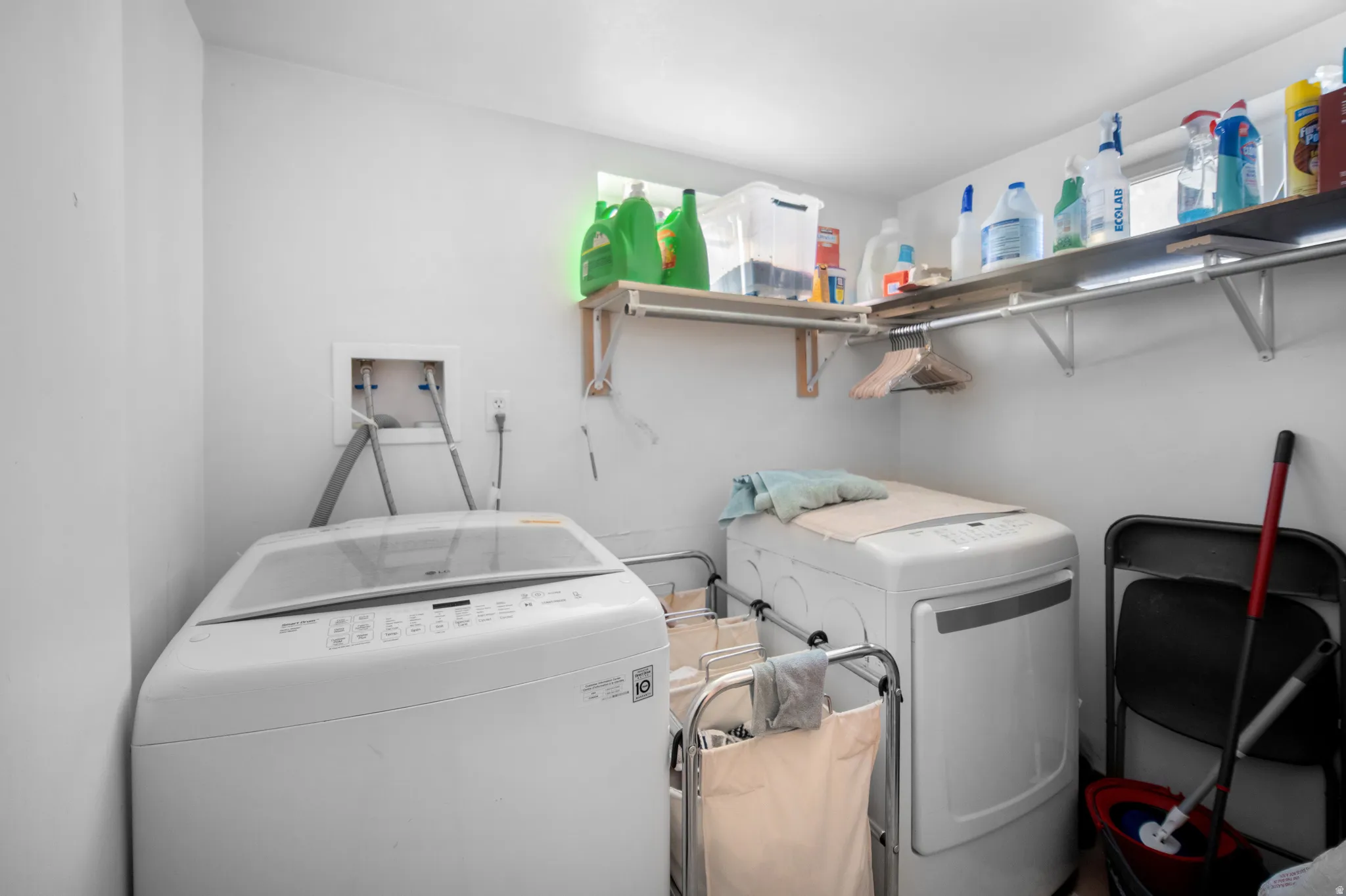 Utility room with plumbing and electrical hookups for laundry appliances