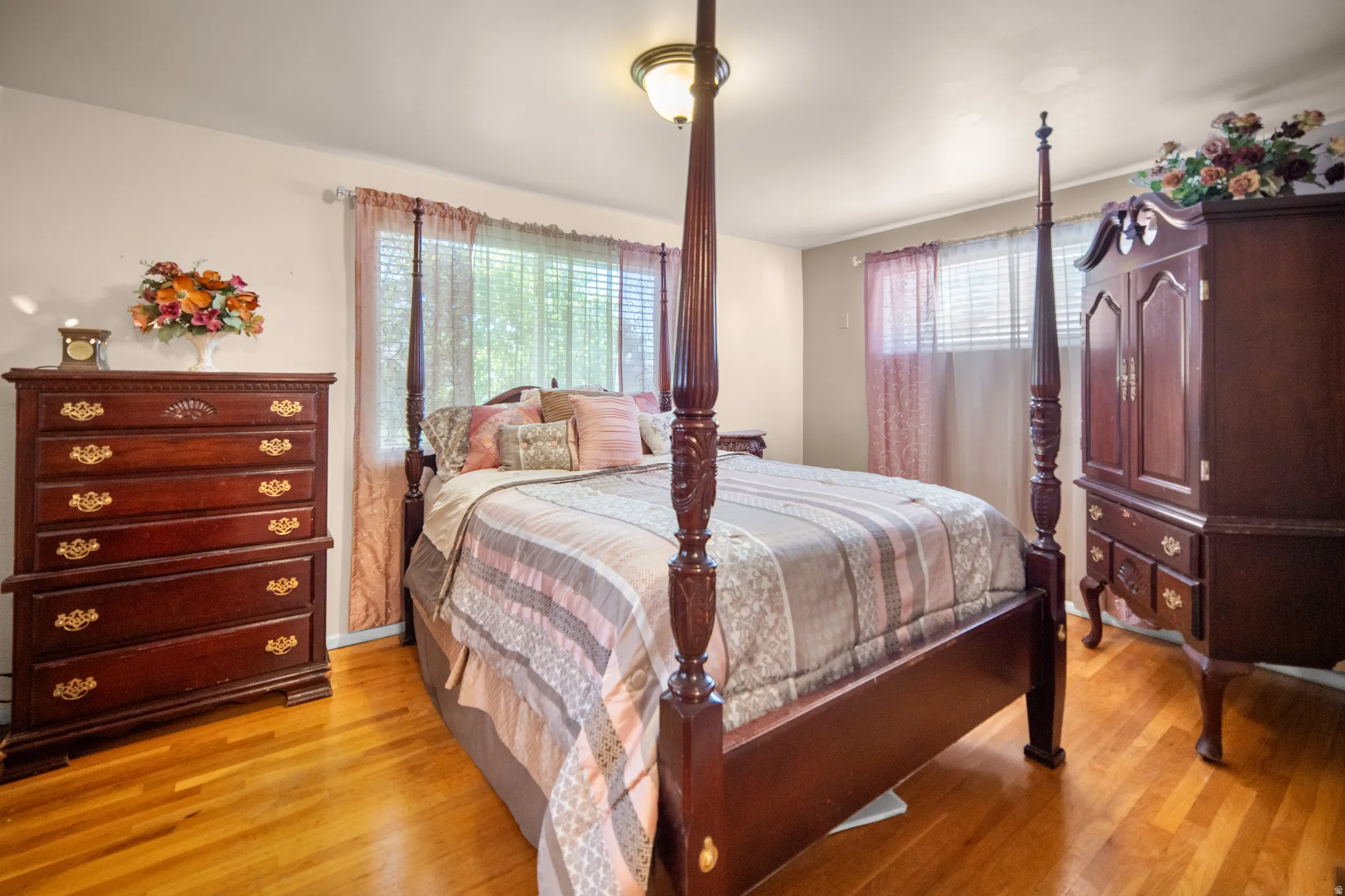 Warm wood-finish flooring complements the neutral wall color