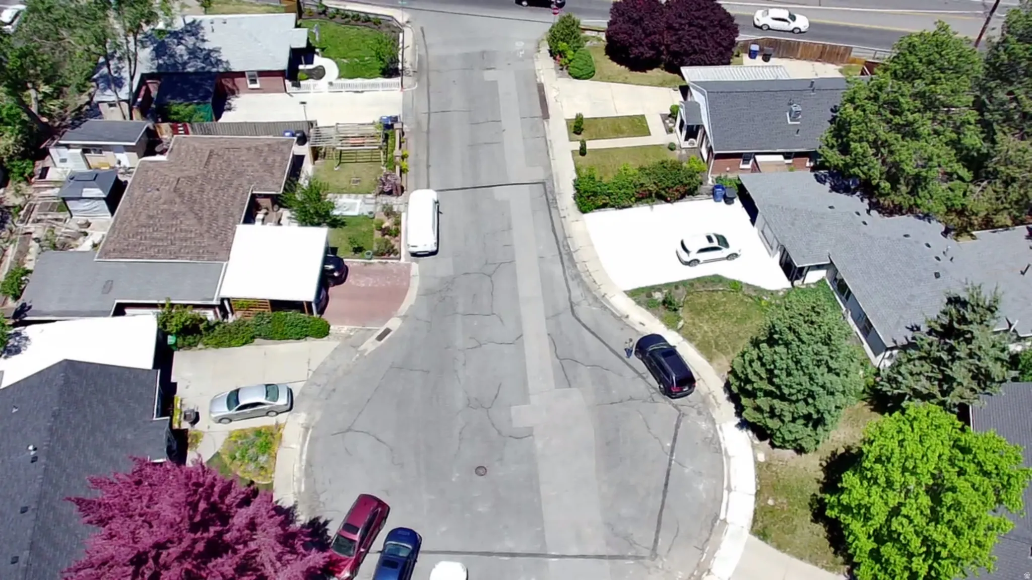 Cul-de-sac street with established landscaping and multiple residential properties