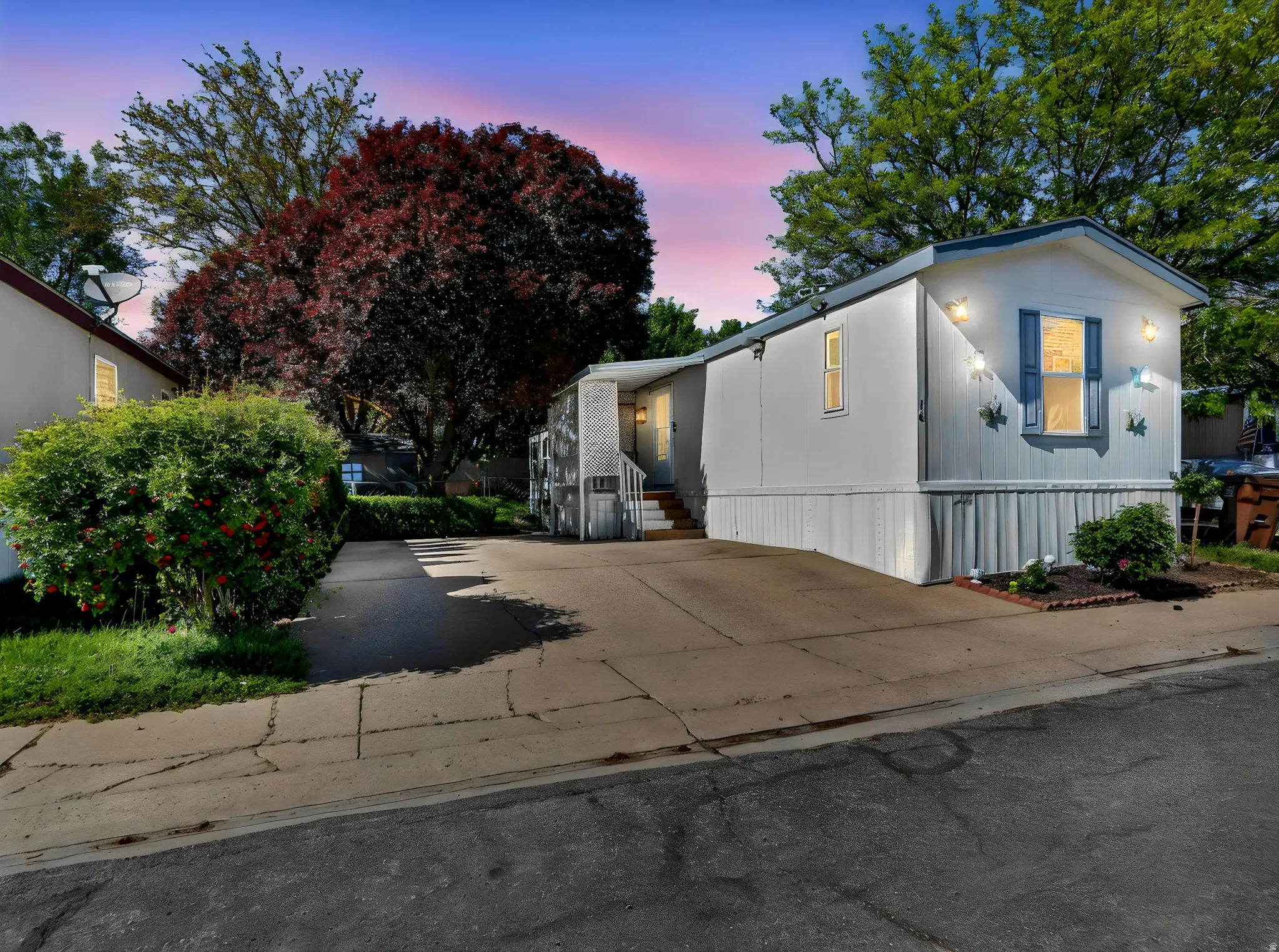 Single-story residence featuring light-colored siding and a contrasting roofline