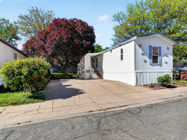 White exterior with blue window shutters