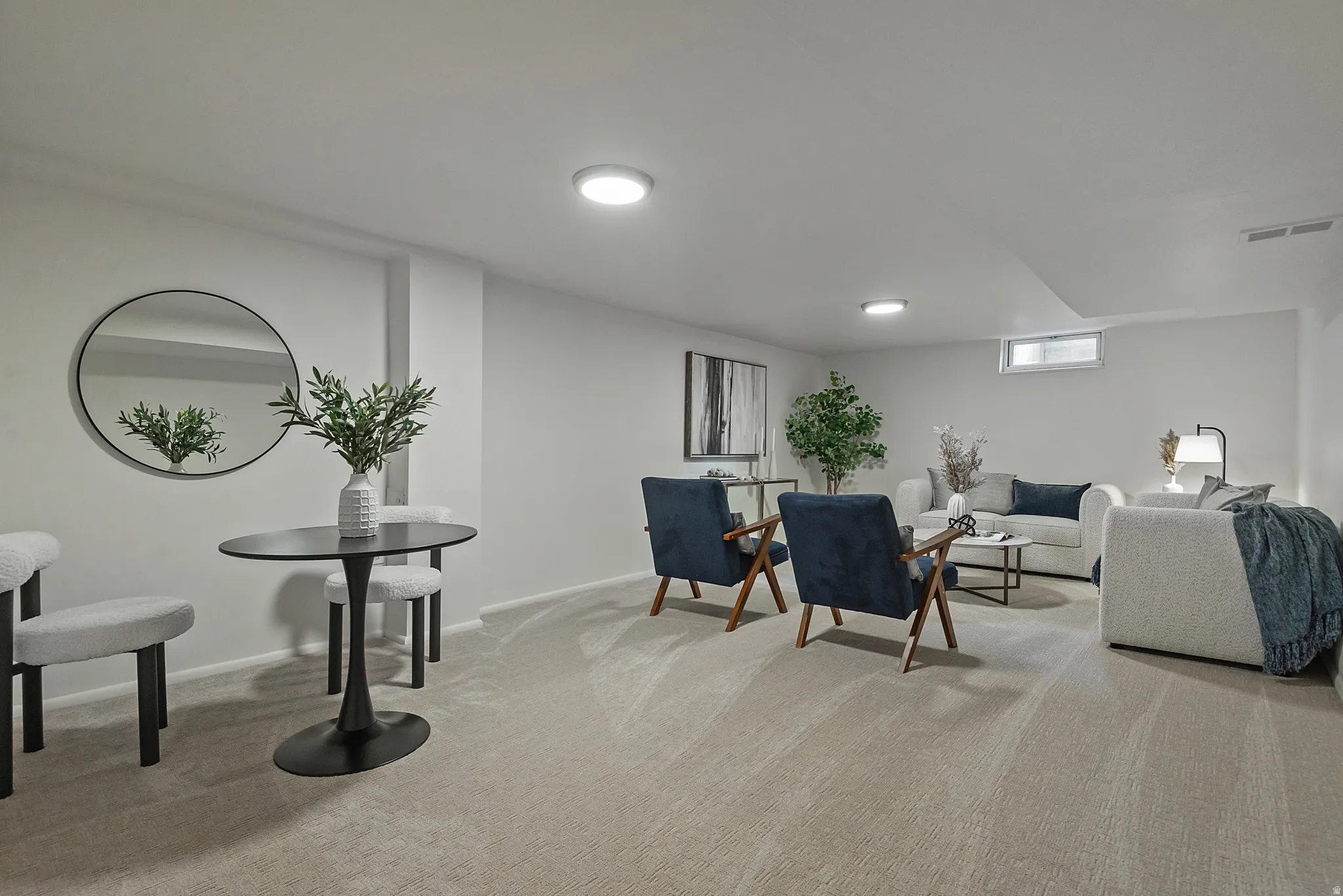 Spacious room featuring light-toned carpeting and recessed ceiling lighting
