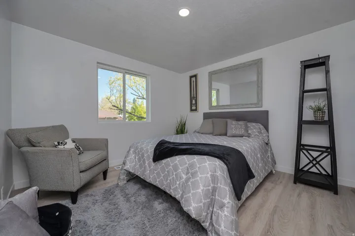 Bright room featuring light-toned wood-finish flooring and white walls