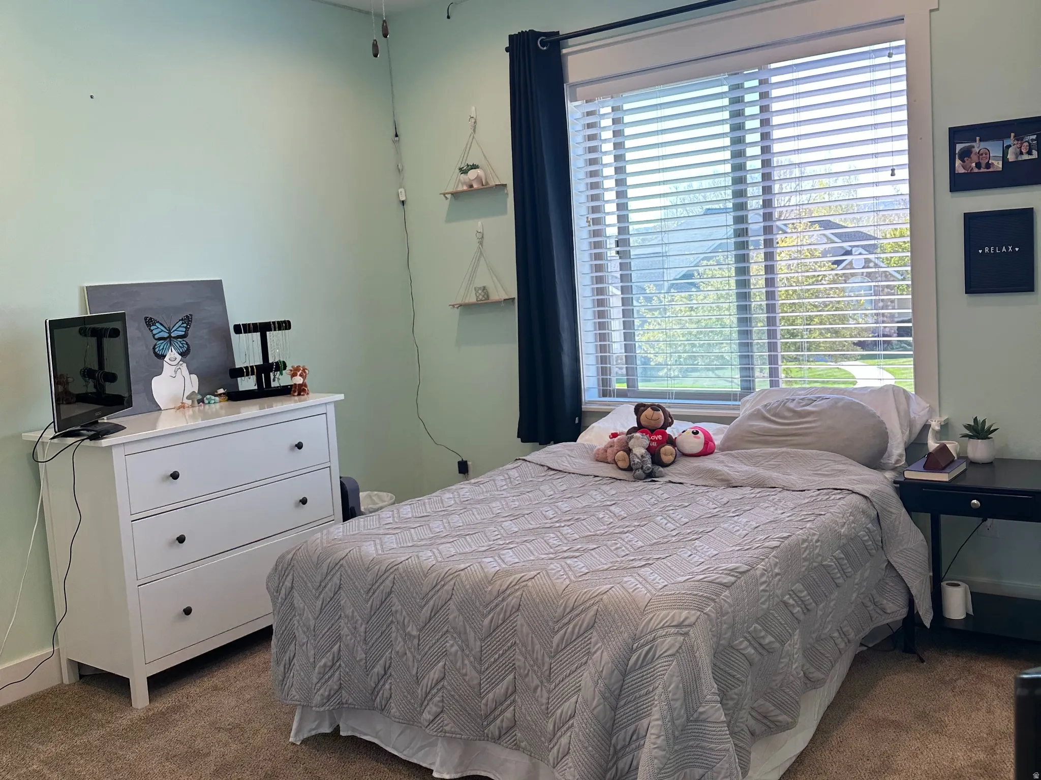 Carpeted room featuring a ceiling fan with integrated lighting, recessed lighting, and a window with blinds