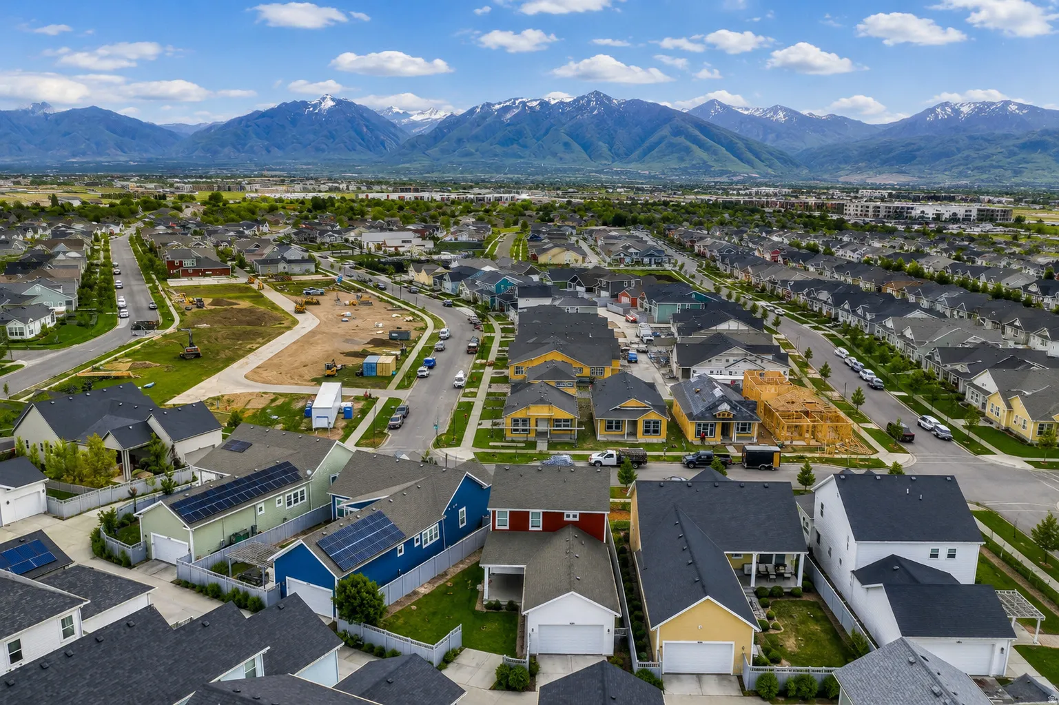 Expansive residential development featuring a variety of single-family homes with diverse architectural styles and rooflines