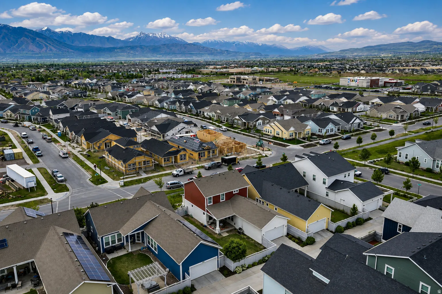 Expansive residential development featuring a variety of single-family homes with diverse exterior finishes