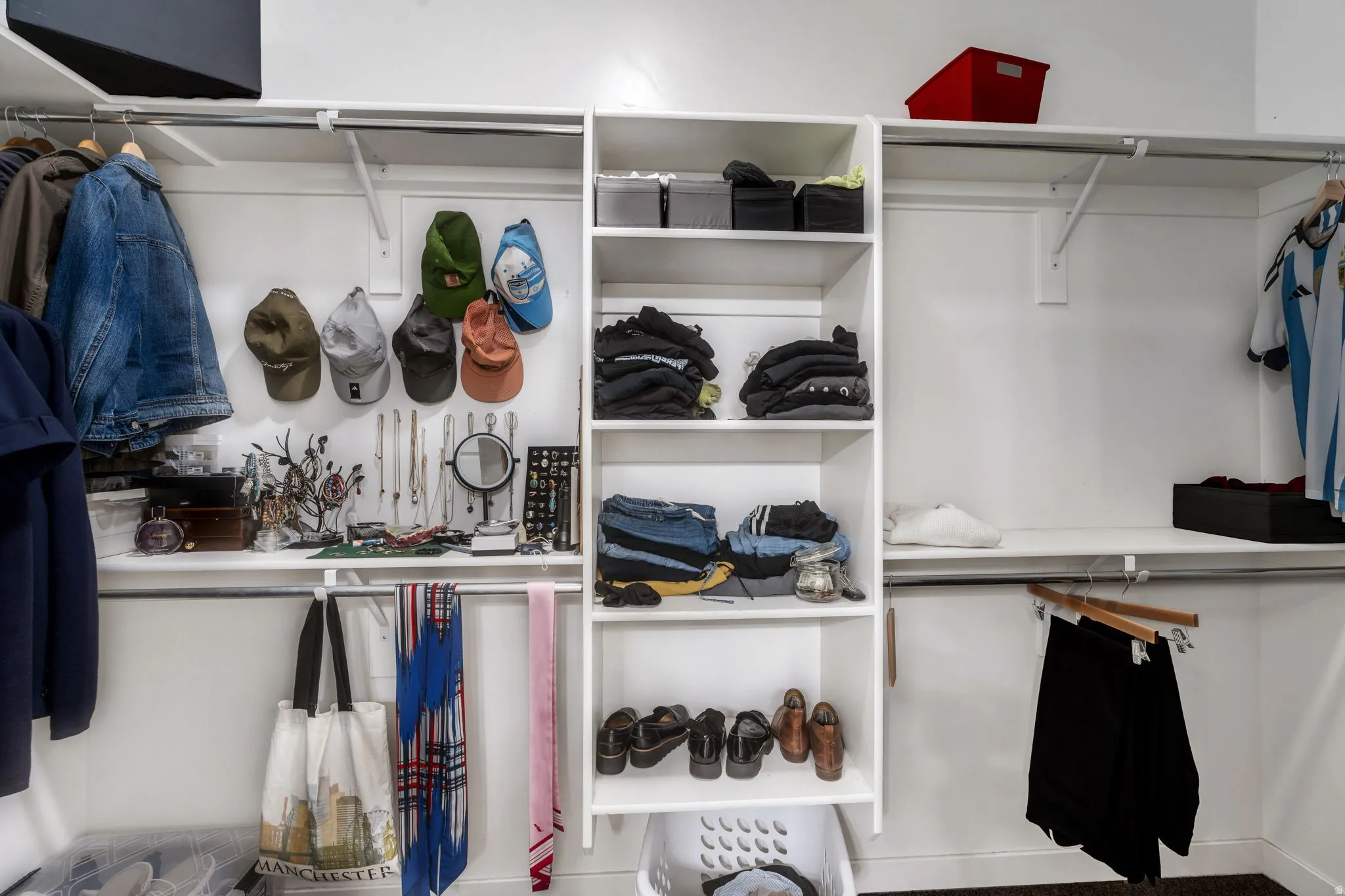 Primary closet has built-in shelving and organizers.
