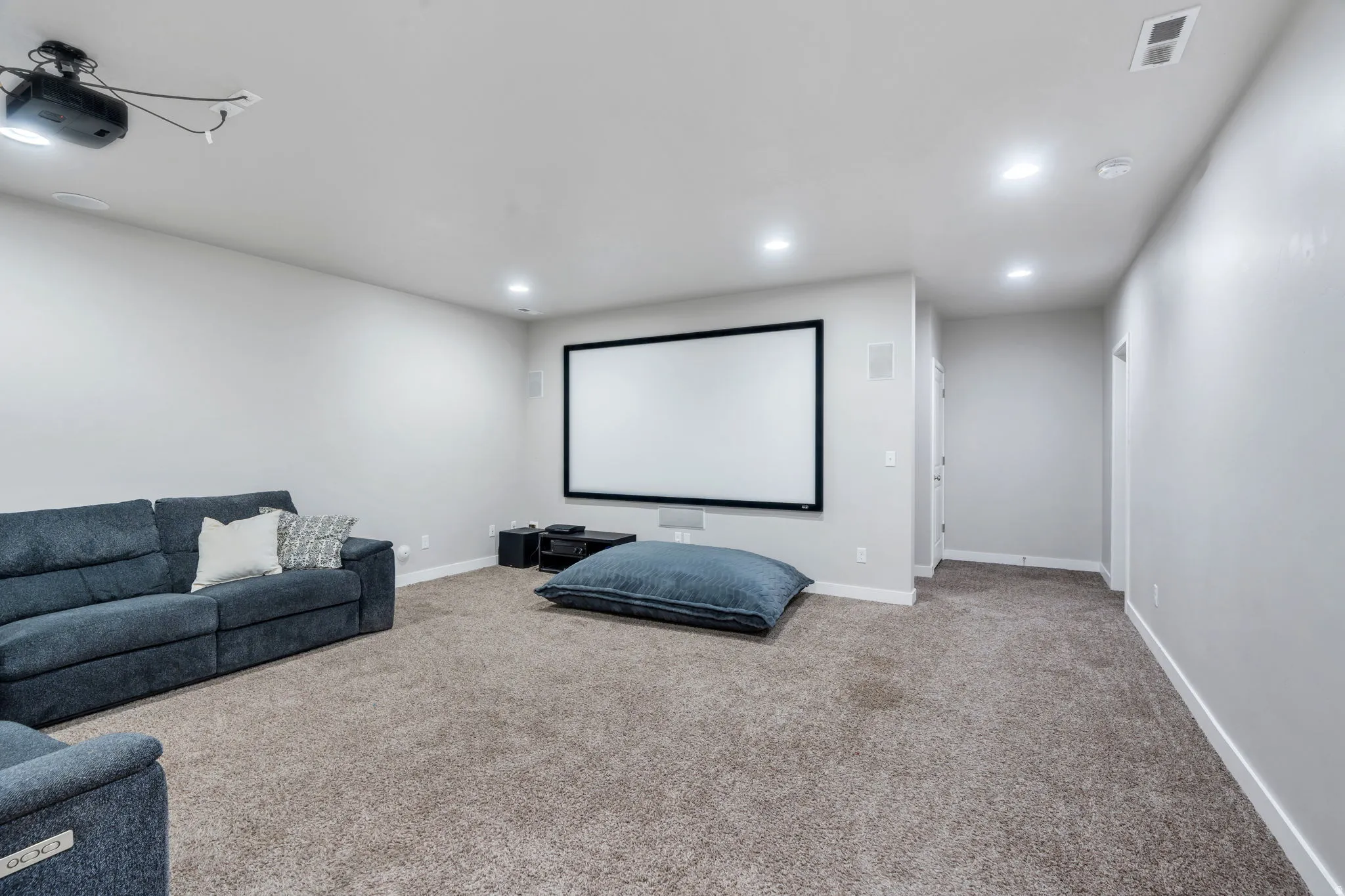 Downstairs family room has projector and screen for movies