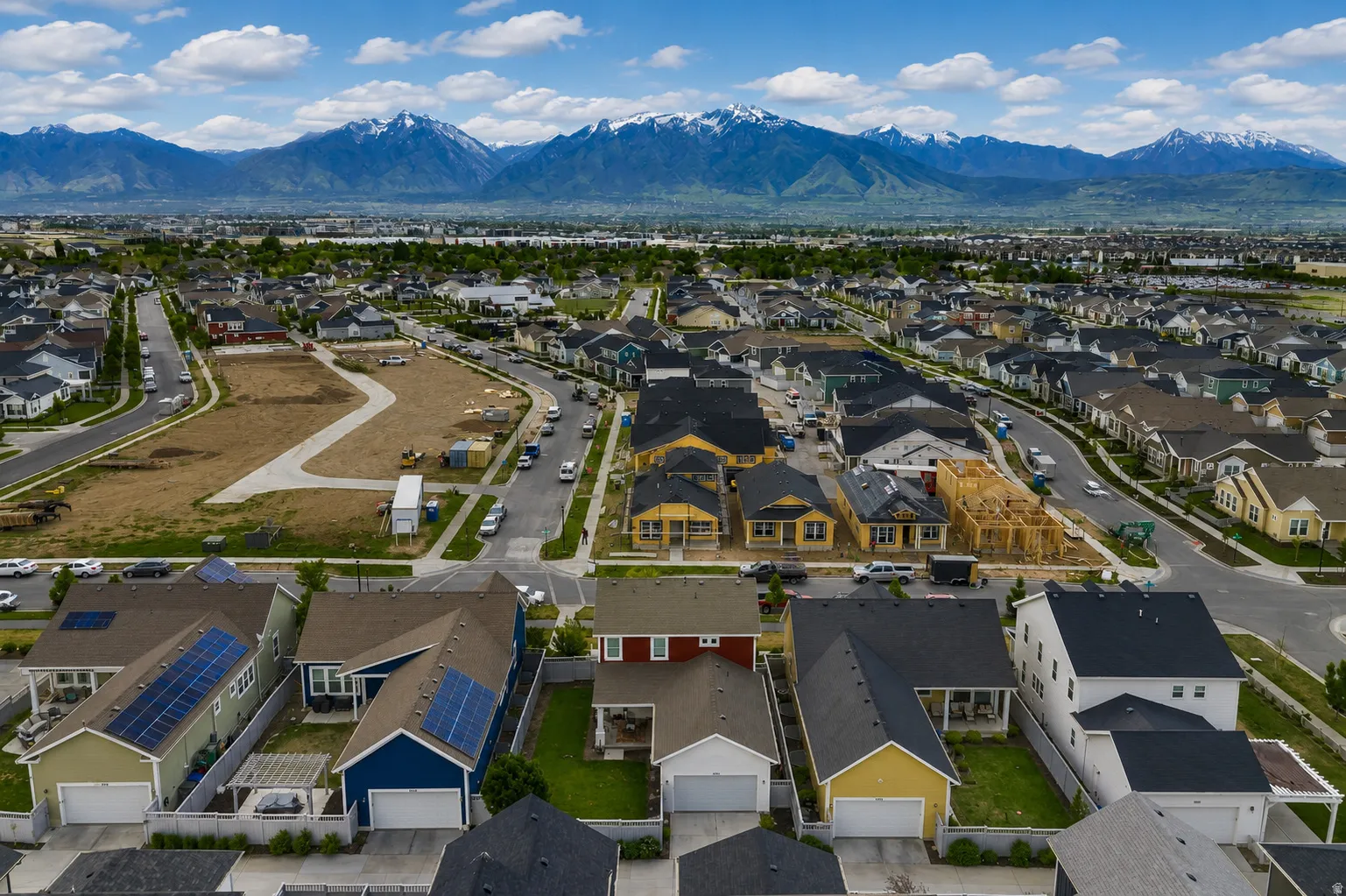 Expansive residential development featuring a variety of single-family homes with mountain scenery