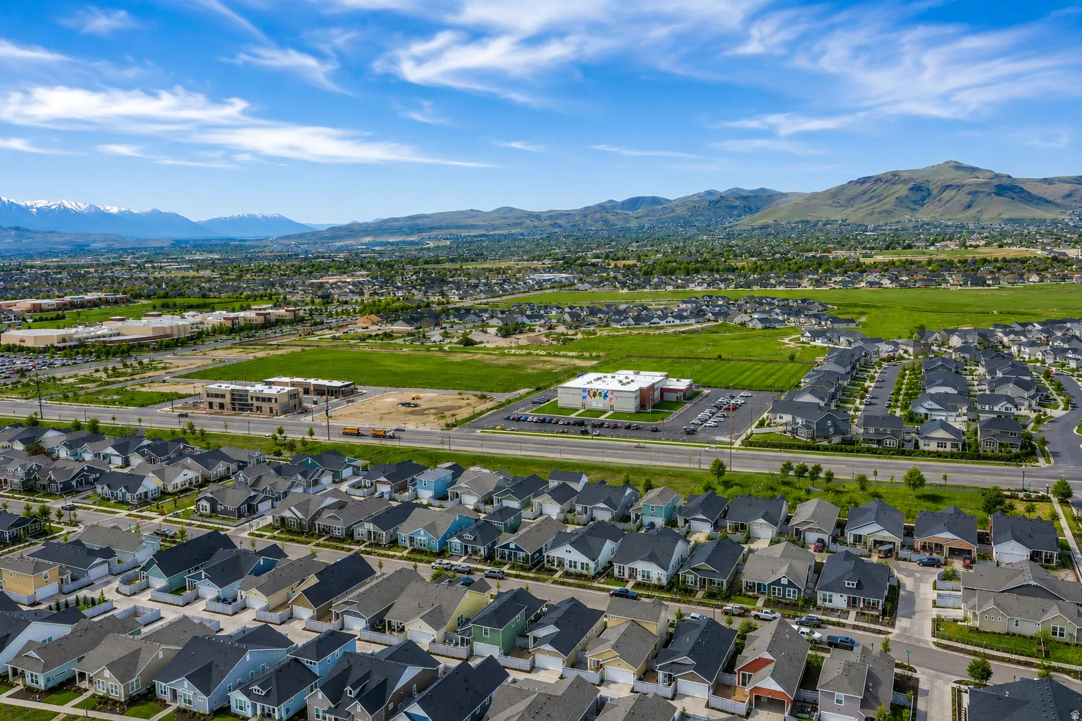 Aerial perspective showcasing a residential community with diverse single-family homes