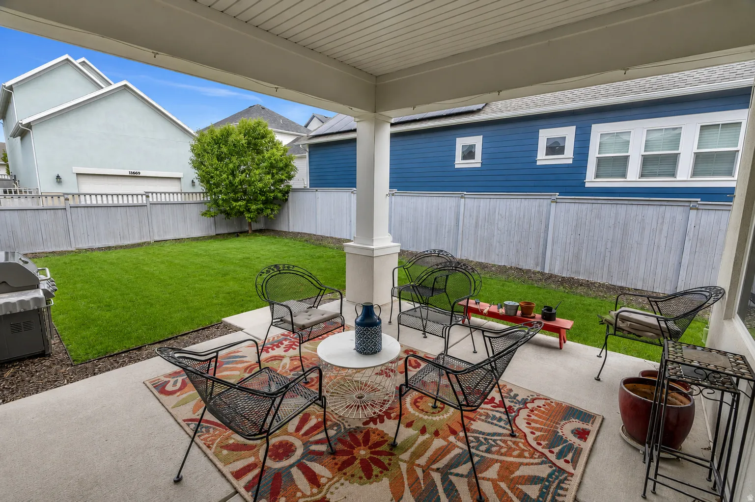 Step outside and enjoy an additional living area under the covered patio. Conveniently located just off the main gathering spaces, it's the perfect place to unwind, dine al fresco, or entertain guests throughout the seasons.