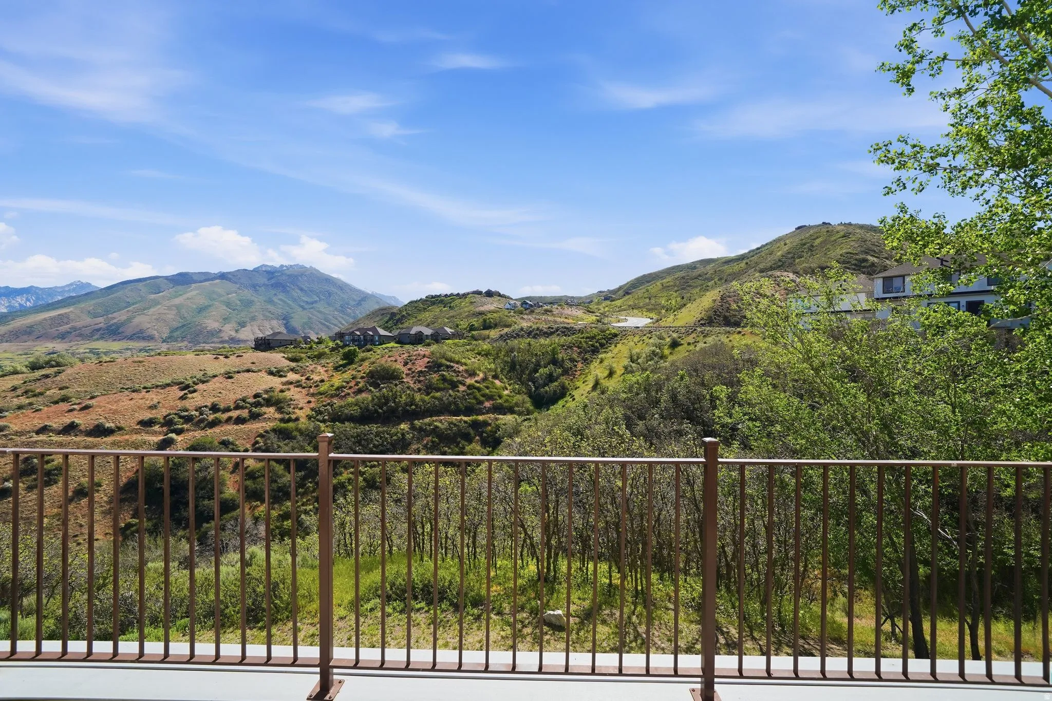 Expansive mountain and valley scenery from a private balcony