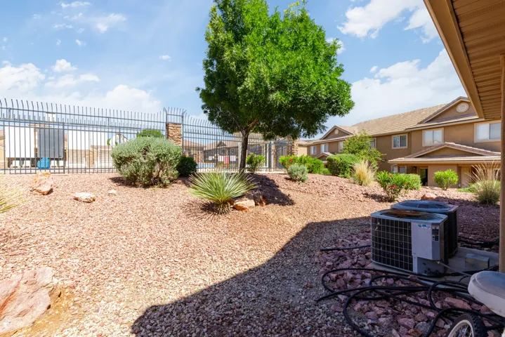 Terraced landscaping with decorative rock and mature desert plantings