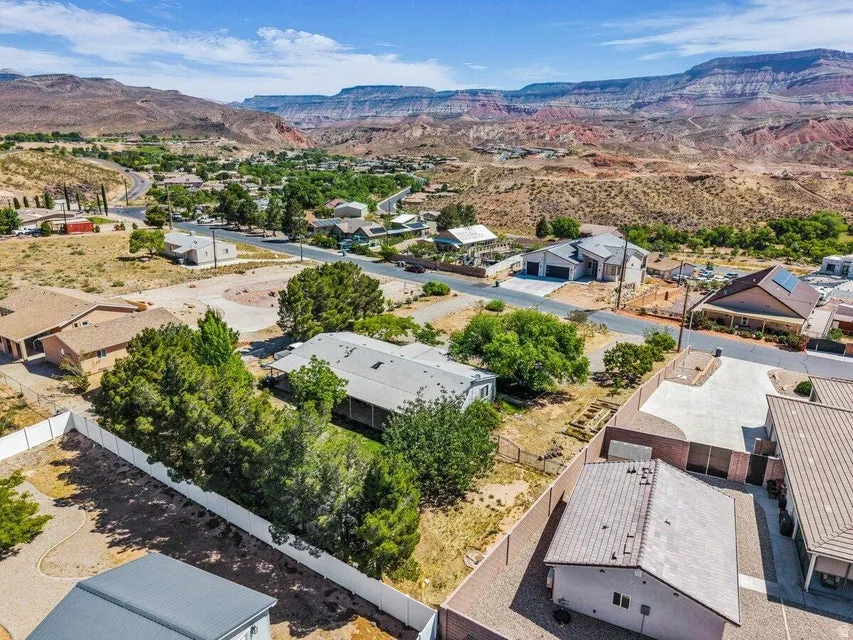Residential property situated against a backdrop of distant mountains