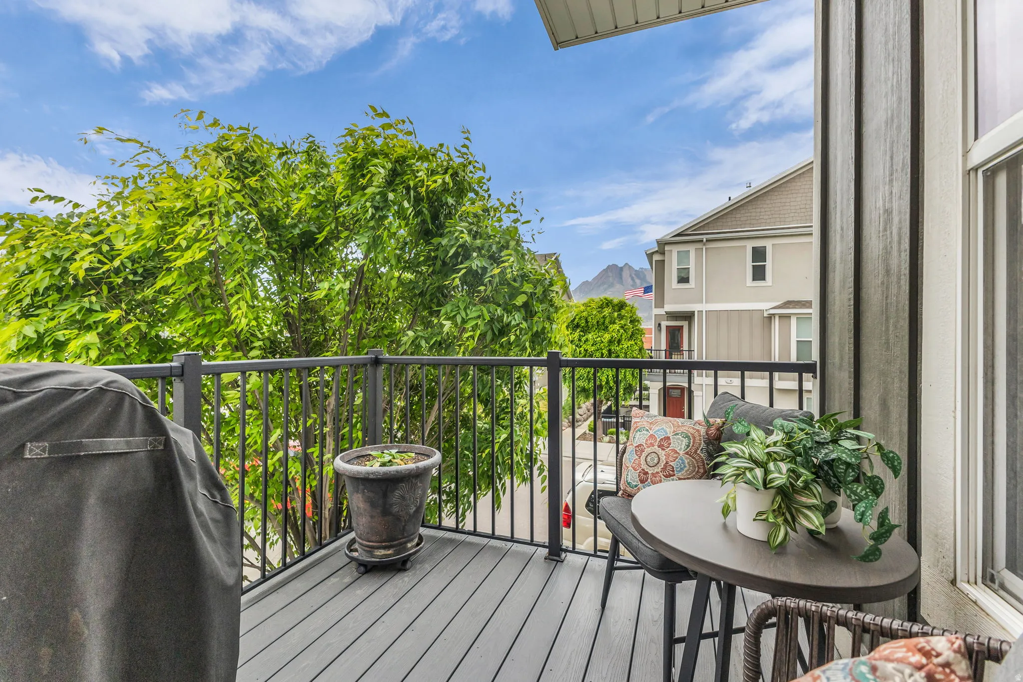 North east corner balcony featuring composite decking, black metal railings and a delightful view