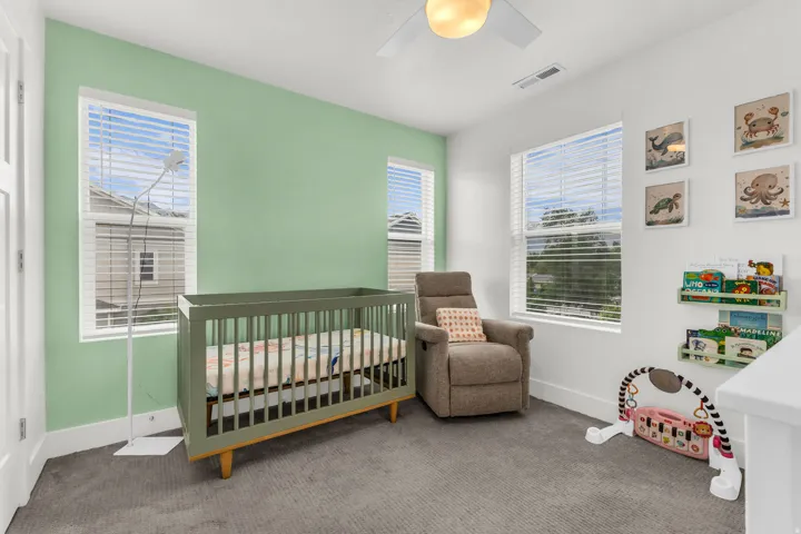 Room featuring two windows with horizontal blinds