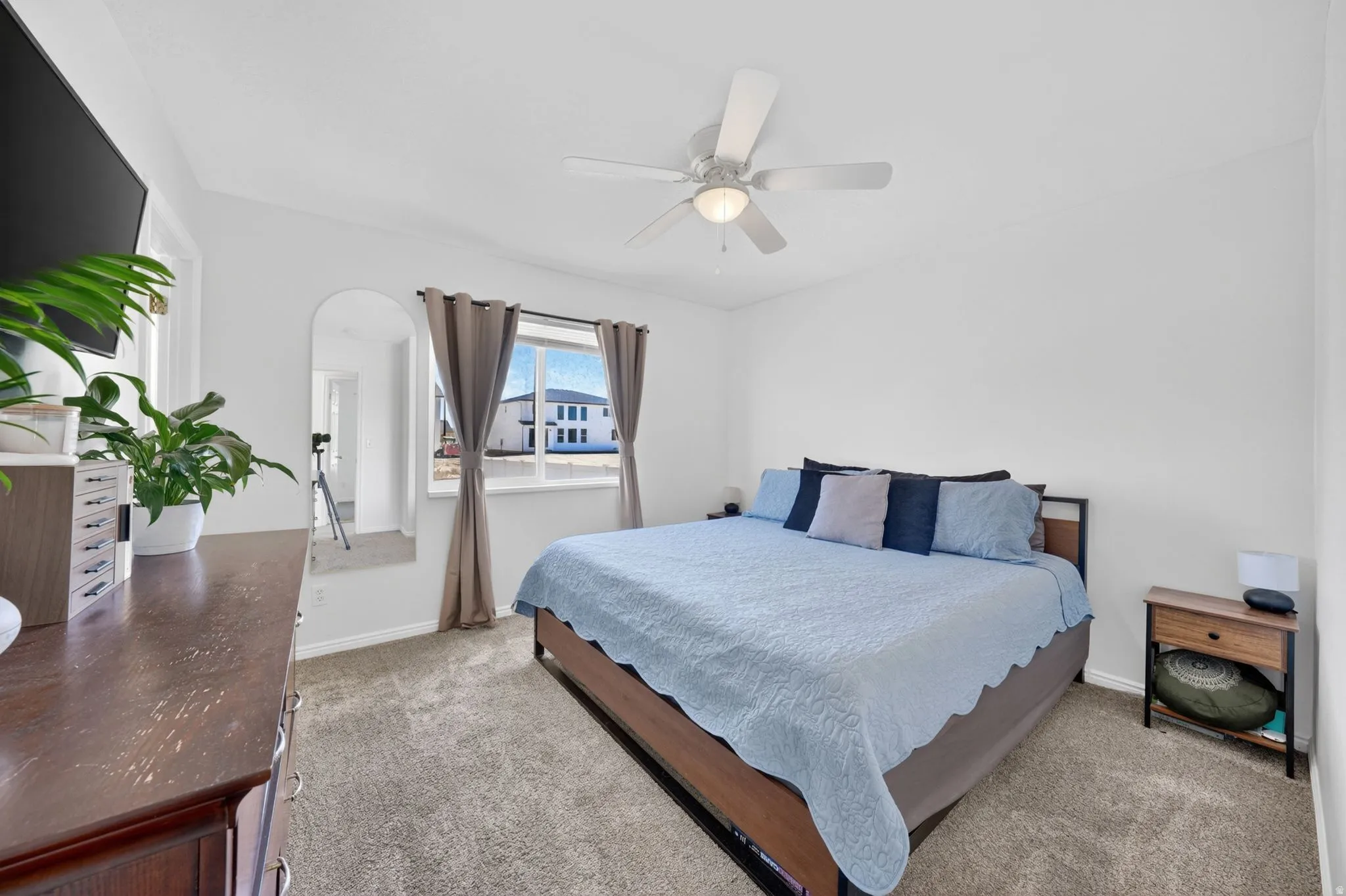 Bedroom featuring neutral carpeting and white walls