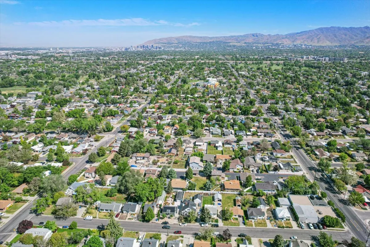 Expansive residential neighborhood featuring mature tree-lined streets and mountain backdrop