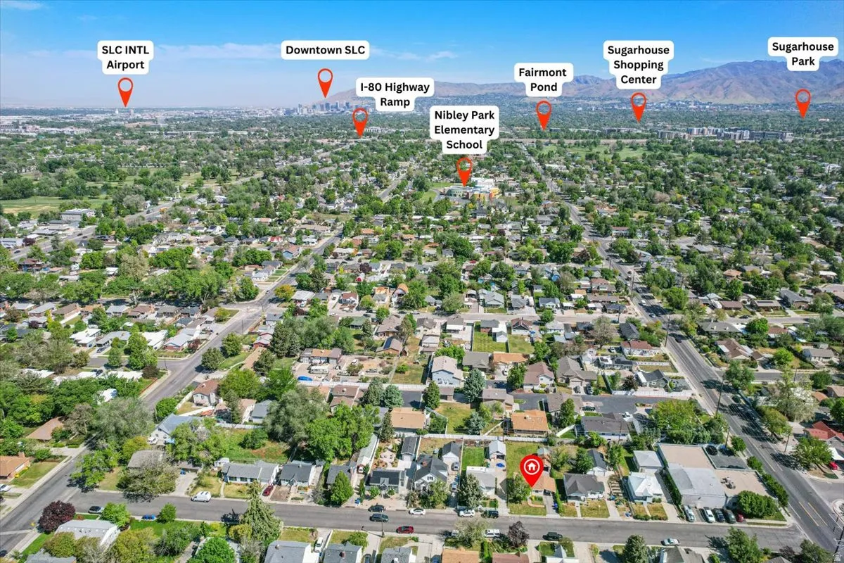 Aerial view showcasing a residential neighborhood with tree-lined streets