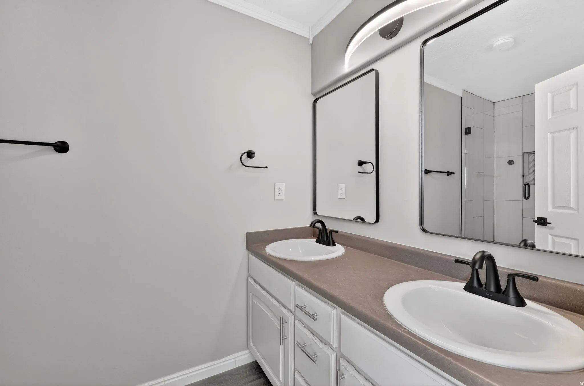 Dual vanity featuring undermount sinks and matte black fixtures