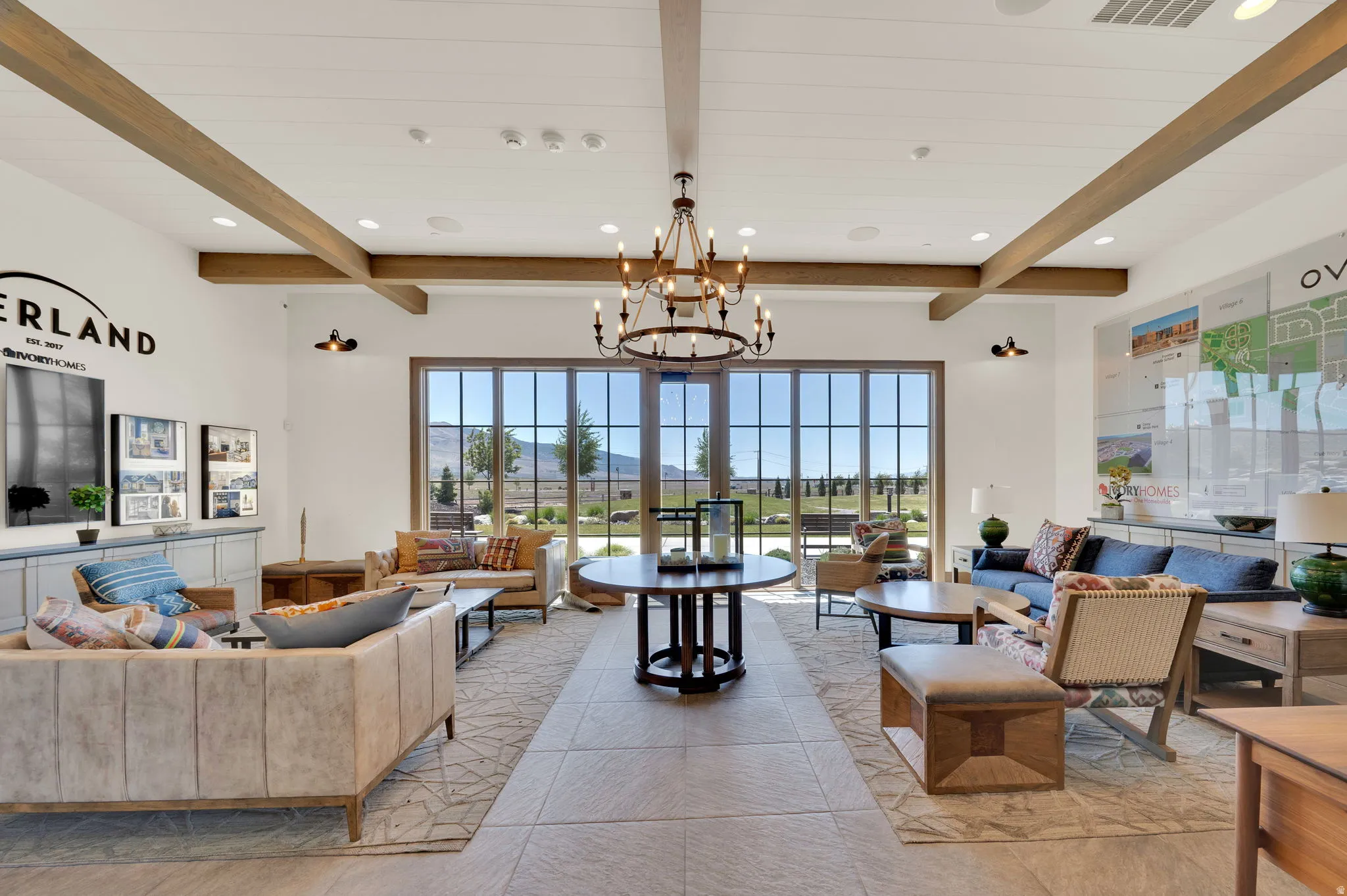 Spacious interior featuring exposed wood ceiling beams and a large chandelier