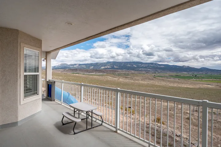Balcony with an expansive mountain and valley backdrop