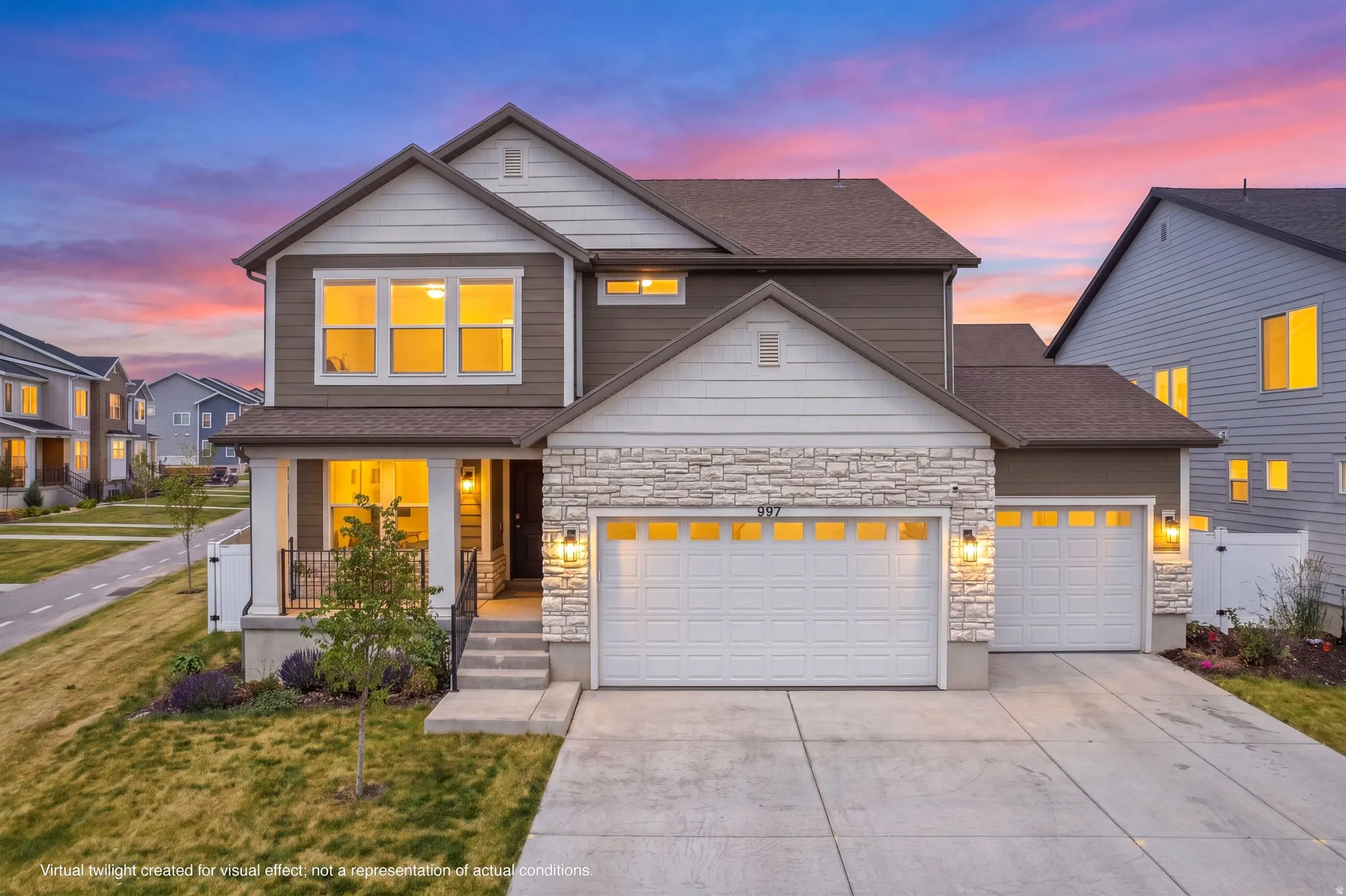 Contemporary exterior featuring a stone facade, a covered front porch with white columns, a two-car garage, and an additional one-car garage
