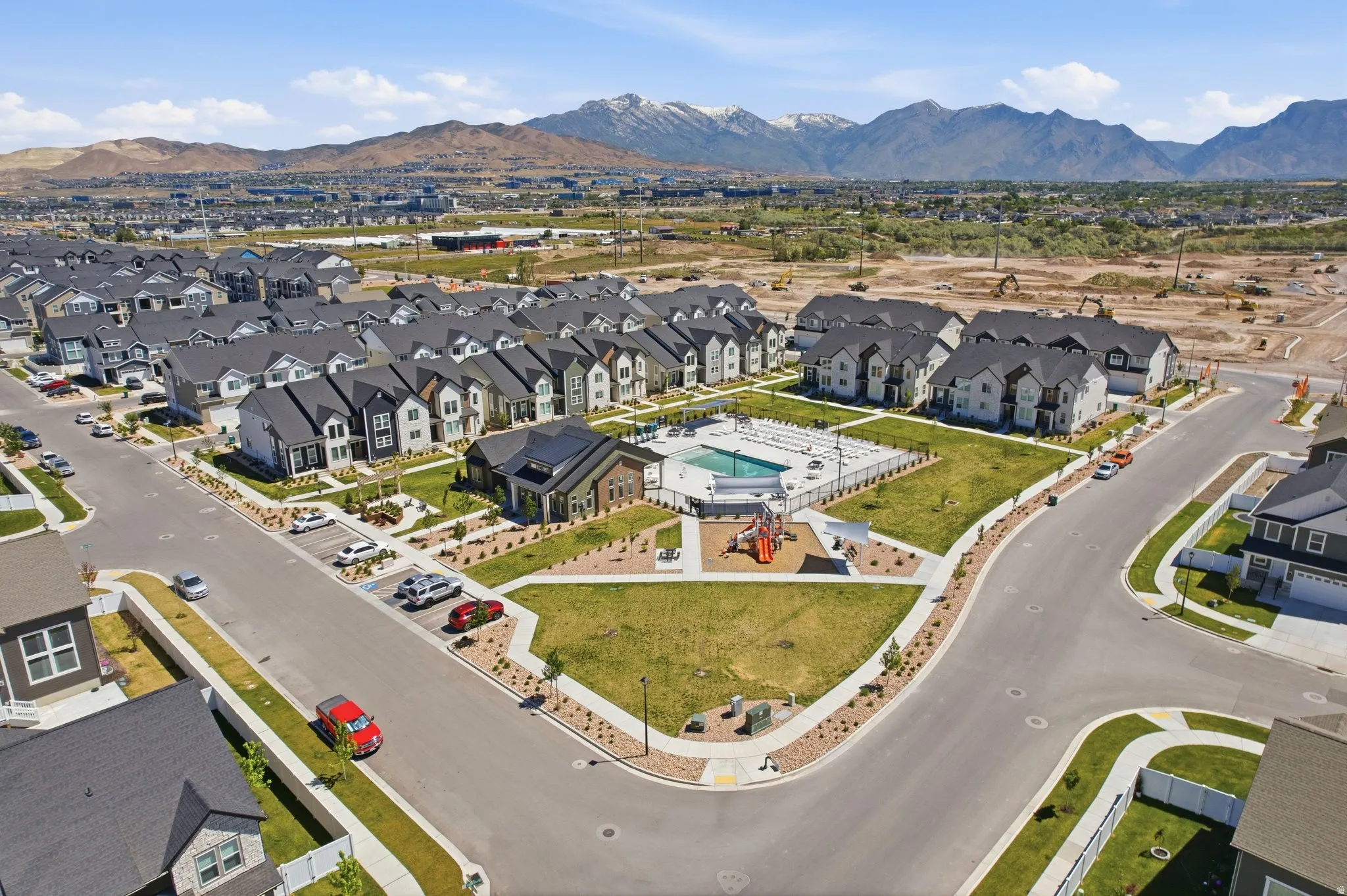 Aerial view of a community pool and clubhouse
