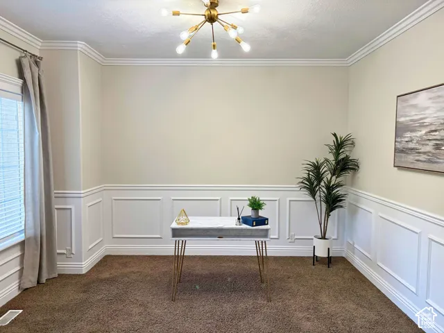 Crown molding accents the ceiling, complemented by wainscoting paneling