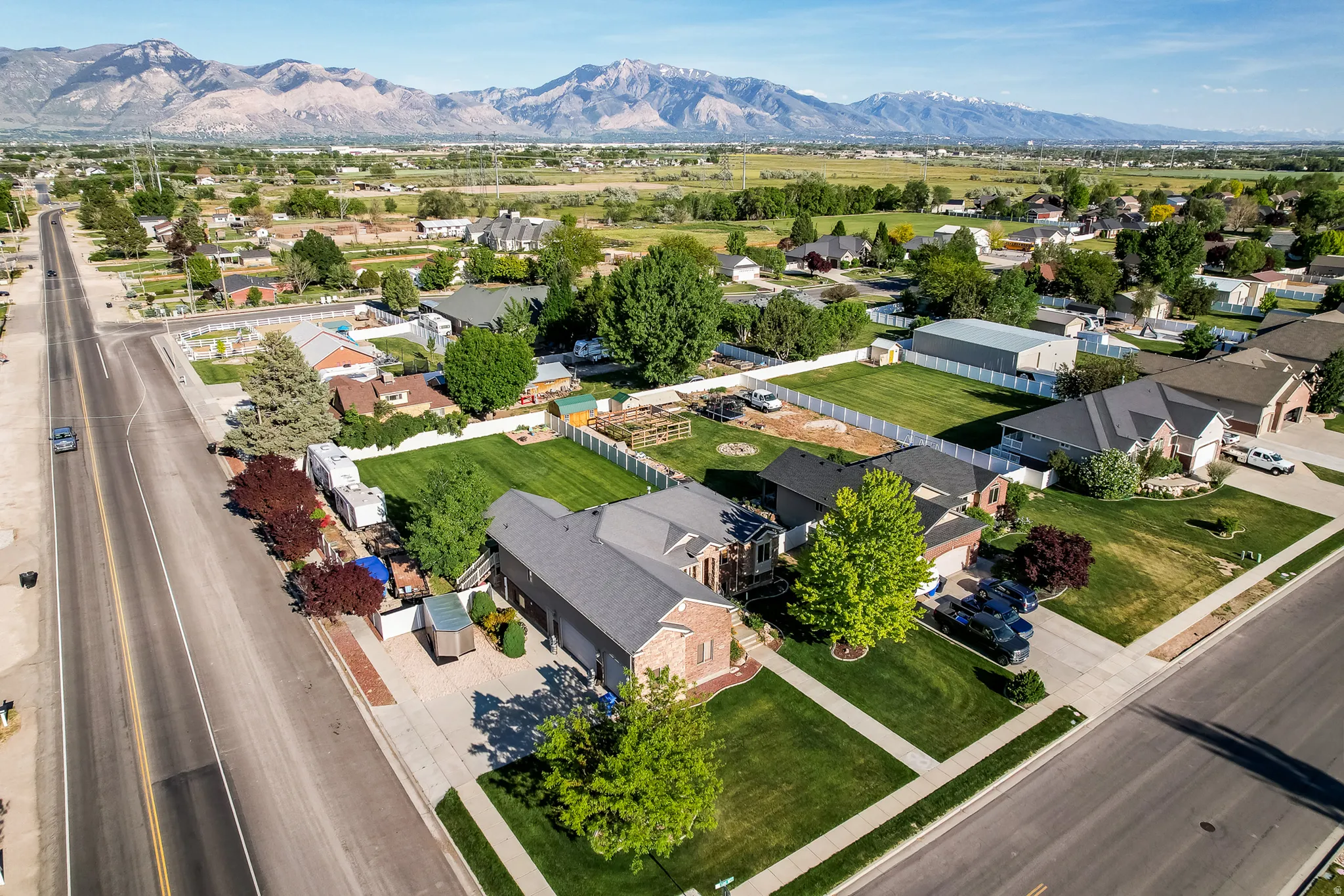Aerial perspective showcasing a residential neighborhood with distant mountains