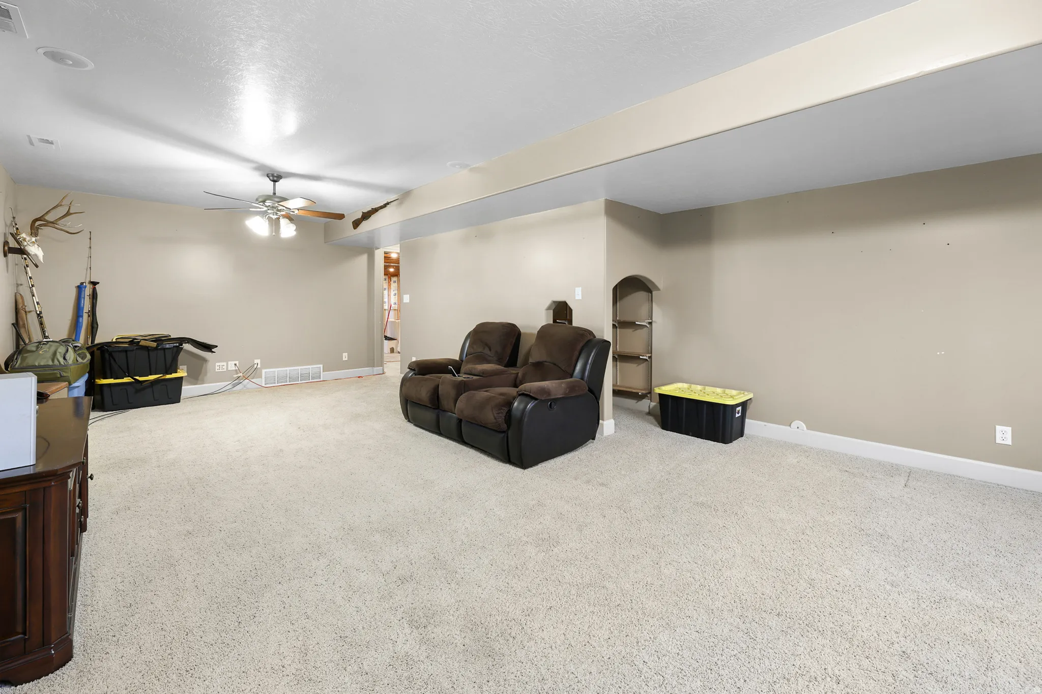 Carpeted room with recessed lighting and a ceiling fan