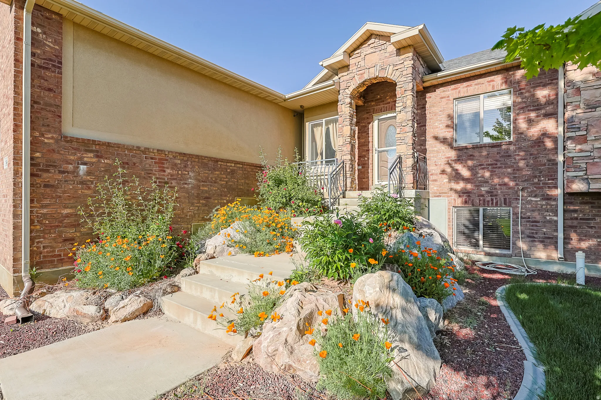 Brick and stucco exterior with stone accents