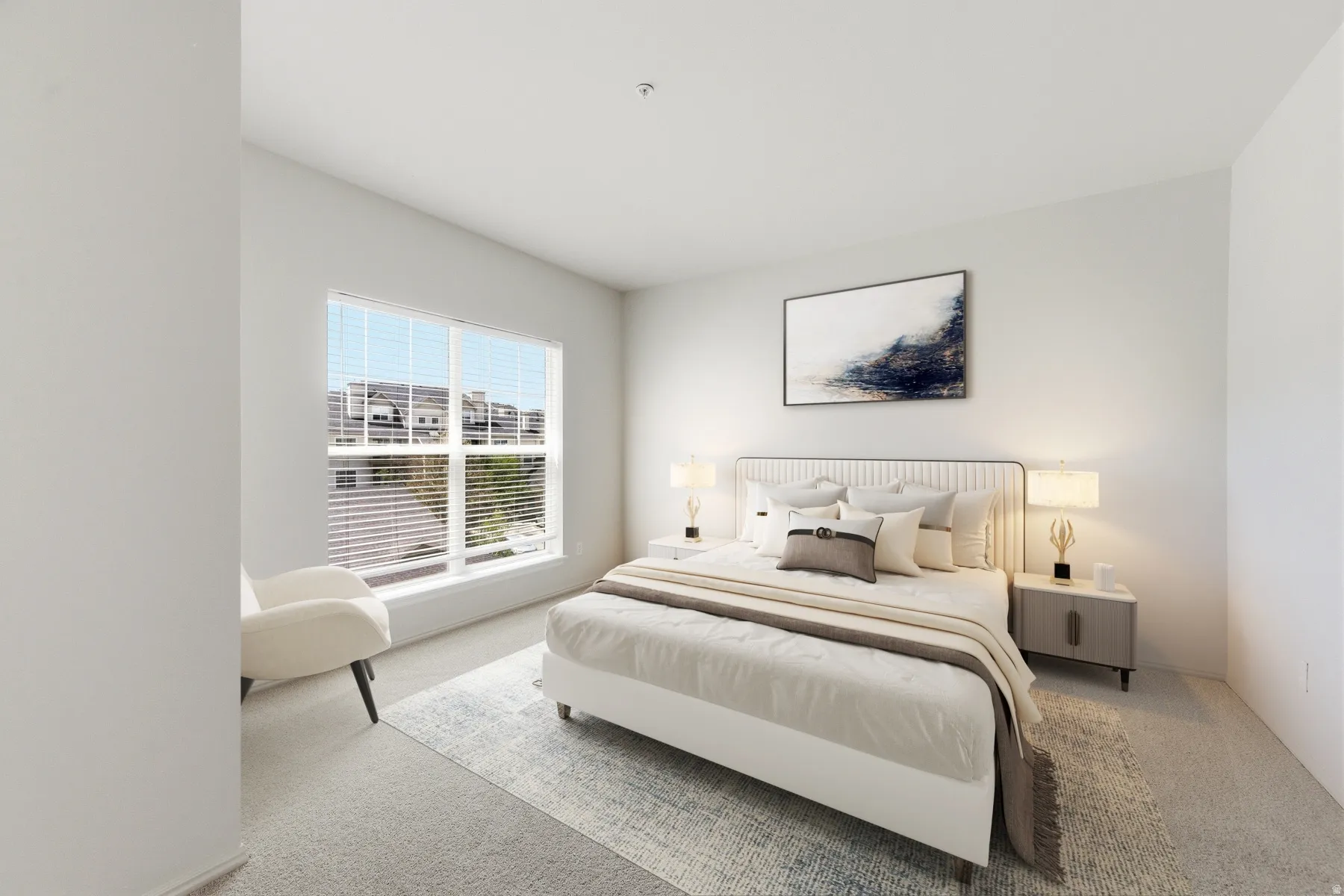 Bright bedroom featuring large windows, neutral carpeting, and a spacious layout