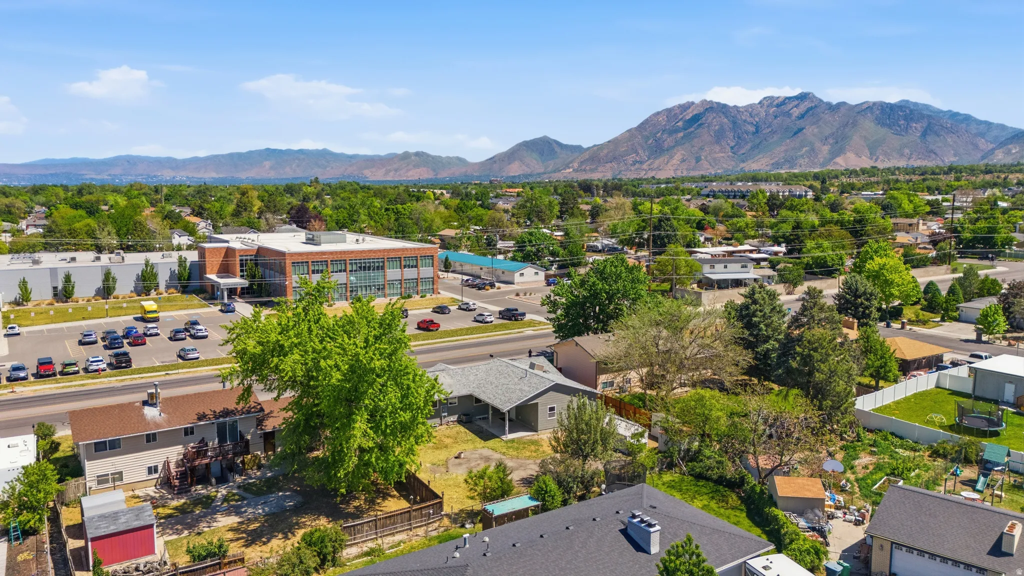 Mountainous terrain and verdant landscape frame this neighborhood setting