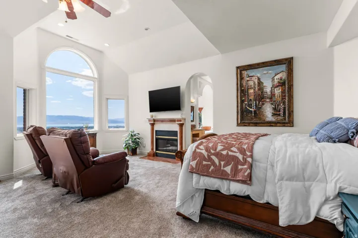 Arched picture window with scenic mountain and lake backdrop