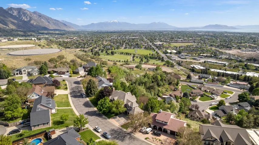 Residential neighborhood with varied architectural styles and mature landscaping