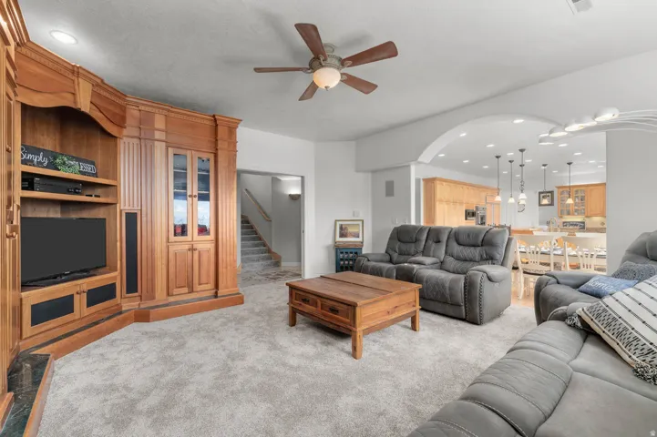 Built-in wood entertainment center with integrated shelving and cabinetry